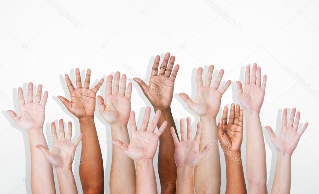 Photo of multiethnic hands in the air